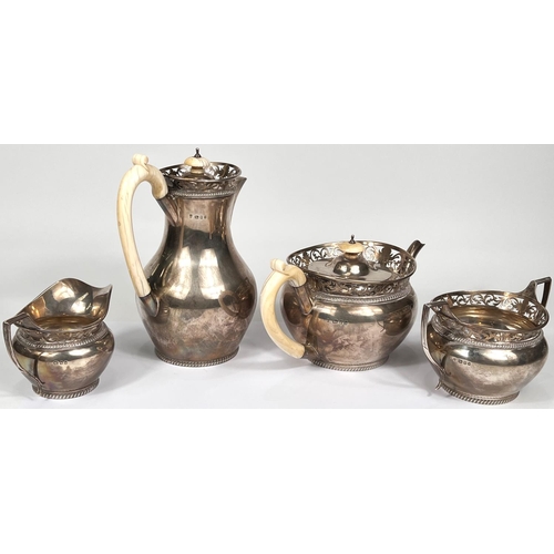 621 - A hallmarked silver 4 piece tea set of baluster form with pierced rims and gadrooned borders, ivory ... 