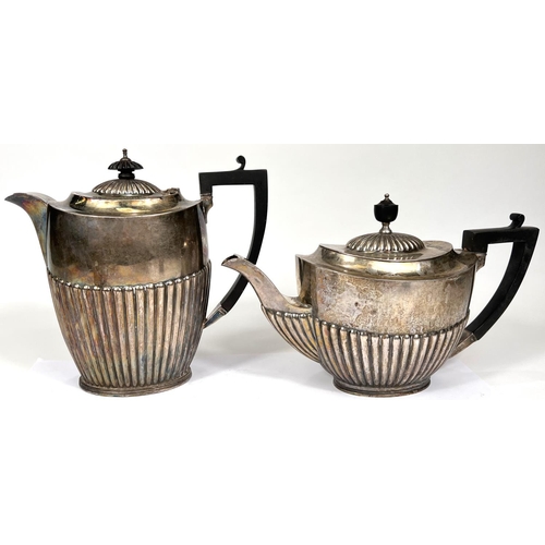 622 - A hallmarked silver matched 4 piece oval tea set, Georgian style with reeded lower bodies, ebonised ... 