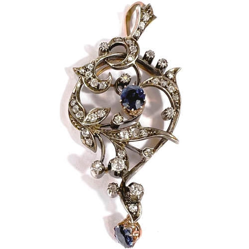 663 - A Victorian silver and gold pendant, set 33 diamonds approx, and 2 natural sapphires in shaped and s...
