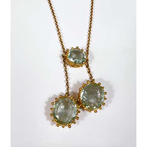 665 - A late Victorian necklace pendant with 3 aquamarine stones in 18 carat gold filigree and scroll moun... 