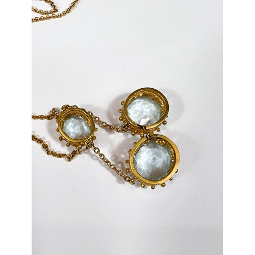 665 - A late Victorian necklace pendant with 3 aquamarine stones in 18 carat gold filigree and scroll moun... 