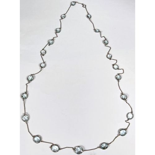 666 - An Art Deco white gold spectacle chain necklace, stamped '18ct' with 22 graduating aquamarine  stone... 