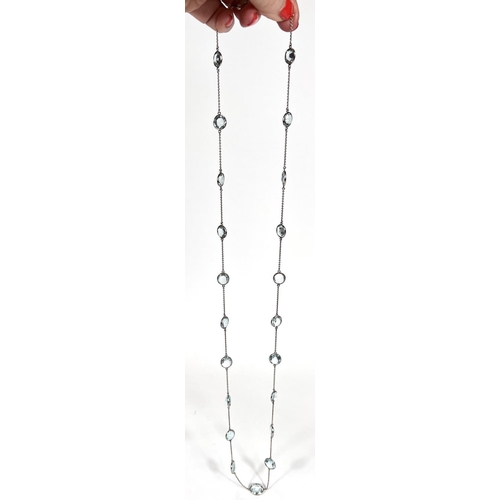 666 - An Art Deco white gold spectacle chain necklace, stamped '18ct' with 22 graduating aquamarine  stone... 