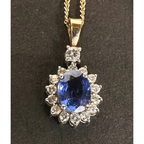 668 - A sapphire and diamond pendant, central sapphire surrounded by diamonds on 18k gold chain 4.7gms