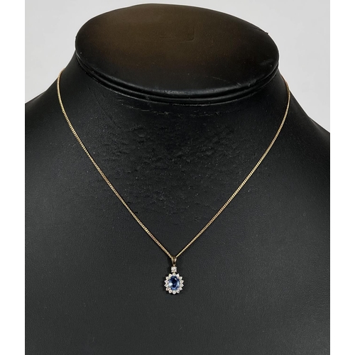 668 - A sapphire and diamond pendant, central sapphire surrounded by diamonds on 18k gold chain 4.7gms