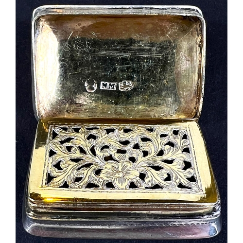 675 - A hallmarked silver rectangular vinaigrette with chased decoration and gilt pierced grill, by Nathan... 