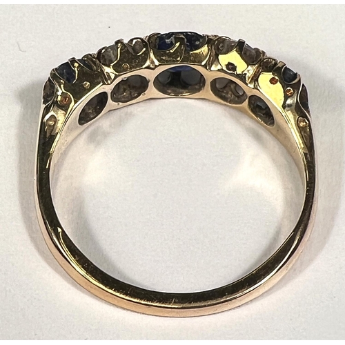 693 - A Victorian style yellow metal ring set 3 alternating sapphires and 2 diamonds, stamped '18ct', cent... 