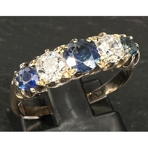 693 - A Victorian style yellow metal ring set 3 alternating sapphires and 2 diamonds, stamped '18ct', cent... 