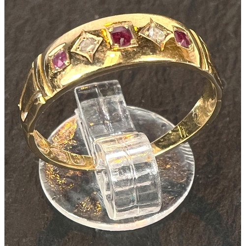 707 - An 18 carat hallmarked gold gypsy ring set 3 small rubies and 2 diamonds, size N, 3gm