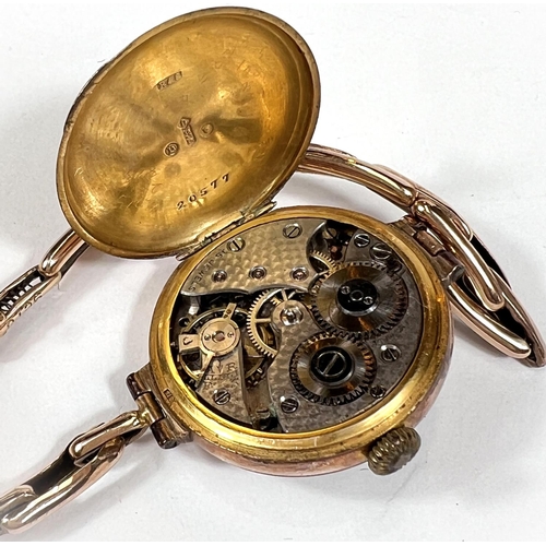 715 - An early 20th century lady's wristwatch in 9 carat hallmarked gold, on extending bracelet, stamped '... 