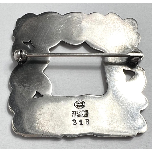 727 - Georg Jensen: A square openwork brooch with resting deer and squirrel in foliage, designed by Arno M... 