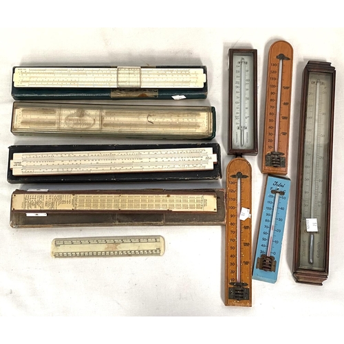 73 - A collection of thermometers; slide rules; etc.