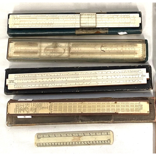 73 - A collection of thermometers; slide rules; etc.