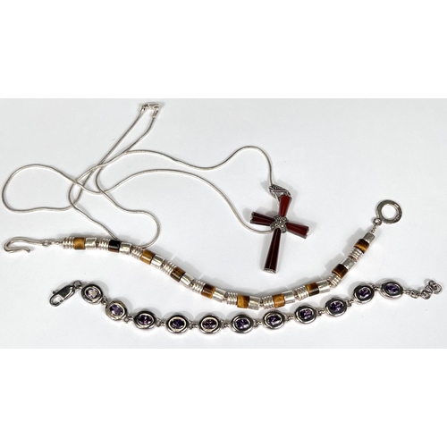 733 - A modern cornelian crucifix set marcasite; a tiger's eye bead bracelet; and another, all marked 925