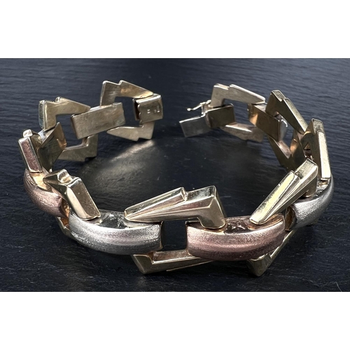 740 - A modern 3 colour gold bracelet with geometric links, 9 carat, 31.9gm