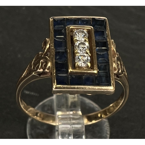 742 - An Art Deco dress ring set 3 diamonds and pave set border of square sapphires, 18 carat gold shank