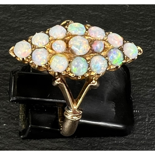 743 - A marquise shaped dress ring set 15 opal beads in yellow gold shank, stamped '15ct'