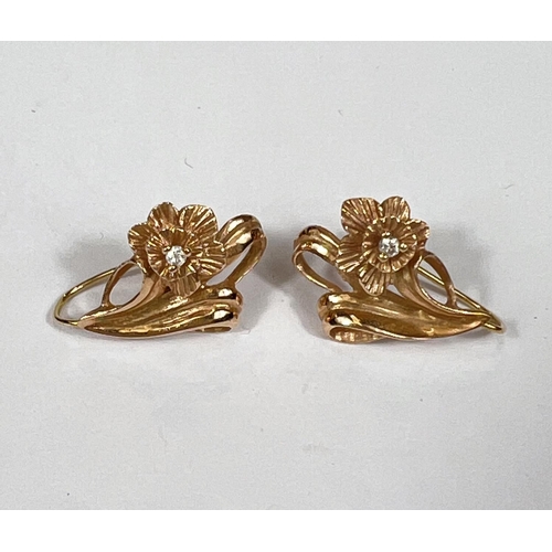 747 - A Stuart Devlin pair of diamond set earrings in the form of lilies, stamped '14k', 4.2gm