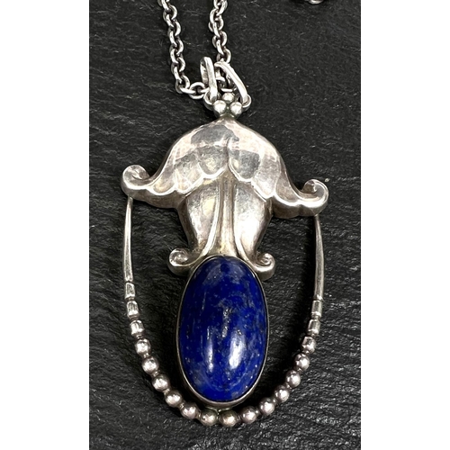 751 - Georg Jensen:  a silver pendant set oval lapis lazuli cabochon, with silver chain