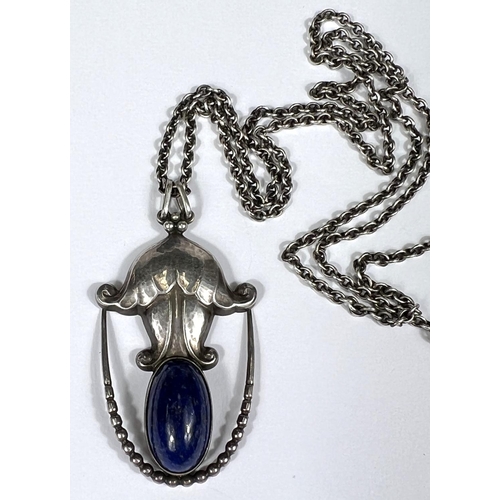 751 - Georg Jensen:  a silver pendant set oval lapis lazuli cabochon, with silver chain