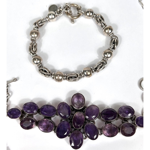 759 - A white metal bracelet set 17 amethyst colour stones; 2 other costume jewellery items