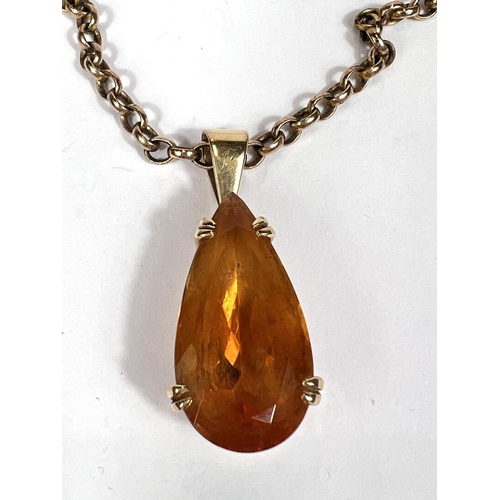 768 - Catherine Best:  a pear shaped citrine in 18 carat gold claw setting, 8.1gm gross; a 9 carat go... 