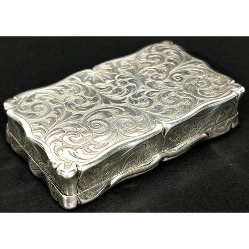 772 - A Victorian silver snuff box, shaped rectangular form with foliate engraving and contemporary inscri... 