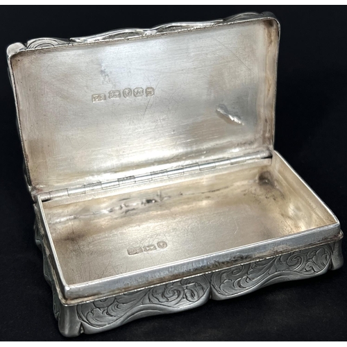 772 - A Victorian silver snuff box, shaped rectangular form with foliate engraving and contemporary inscri... 