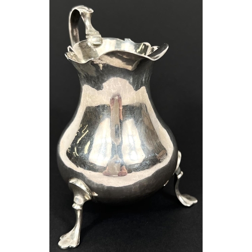 776 - A mid Georgian silver cream jug of plain baluster form, London 1762, maker AN*1, 73gm