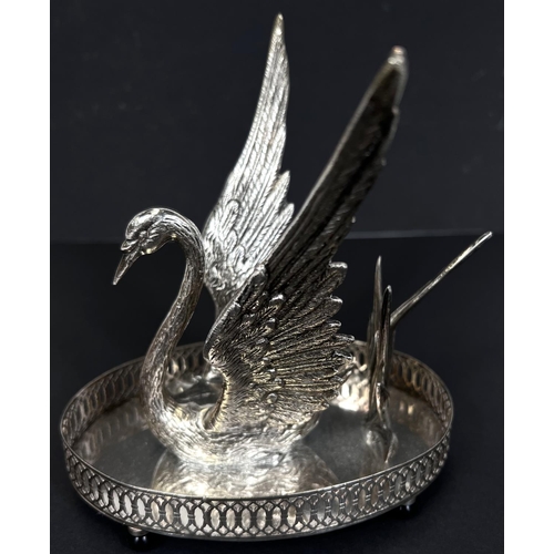 792 - A silver plated swan shaped bandy warmer with central light.