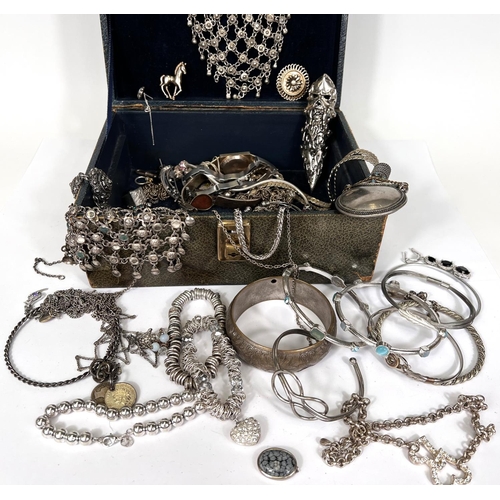 795 - A vintage jewellery box with contents, white metal jewellery including silver necklaces and bracelet... 