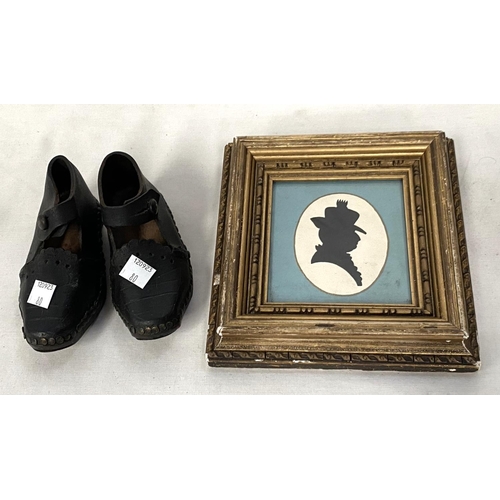 80 - A pair of 19th century child's clogs; a silhouette, female head and shoulders, framed and glazed