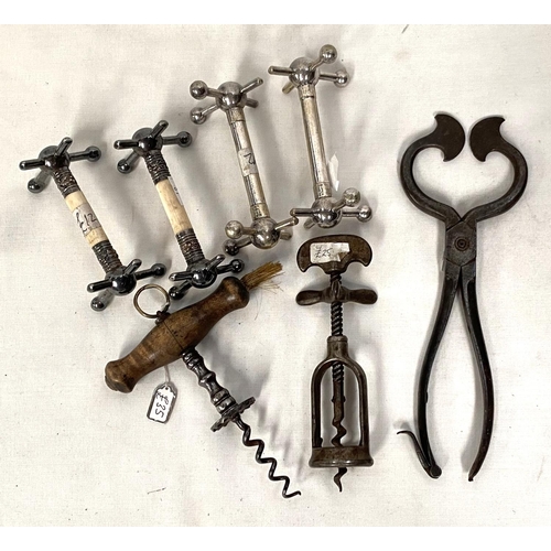 81 - Two 19th century vintage corkscrews; a pair of sugar nips