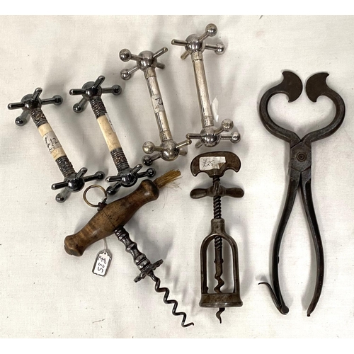 81 - Two 19th century vintage corkscrews; a pair of sugar nips