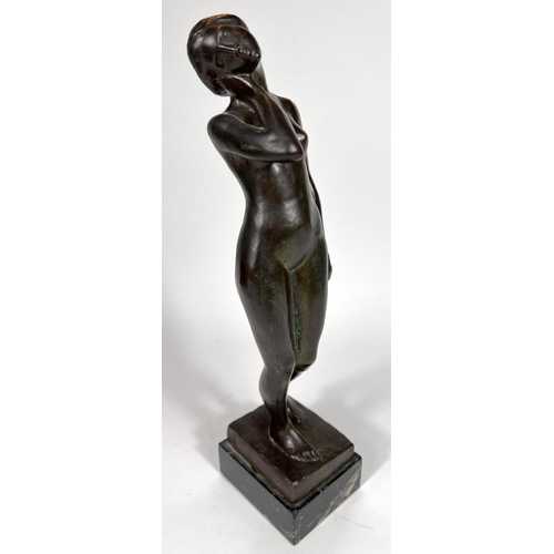 831 - Van de Voorde (1878-1970):  bronze female nude standing holding her neck, on marble base, signed, he... 