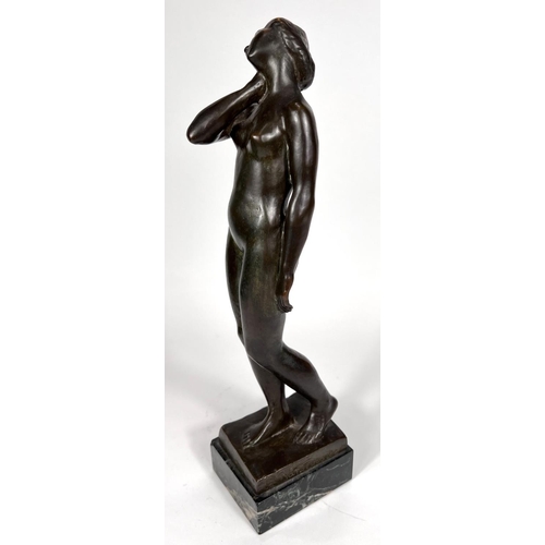 831 - Van de Voorde (1878-1970):  bronze female nude standing holding her neck, on marble base, signed, he... 