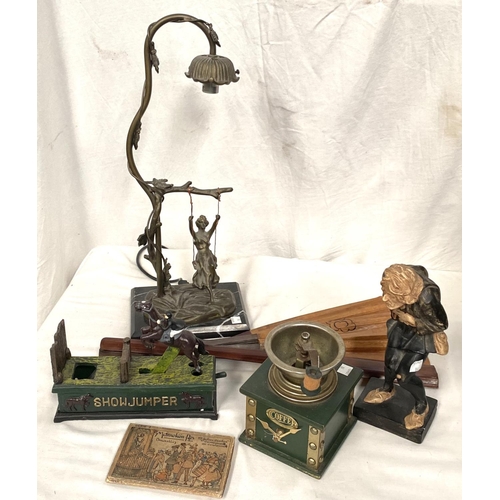 86 - A gilt metal table lamp with girl on a swing; a Victorian style cast iron money box; a coffee grinde... 