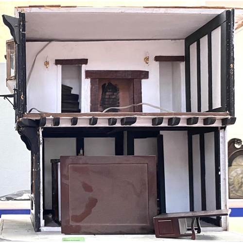 87 - A half timbered doll's house of 3 storeys, with furnitureNo bids sold with next lot