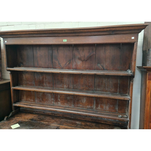 904 - An 18th century Country made Welsh dresser with 3 height delft rack over 3 frieze drawers, 2 side cu... 