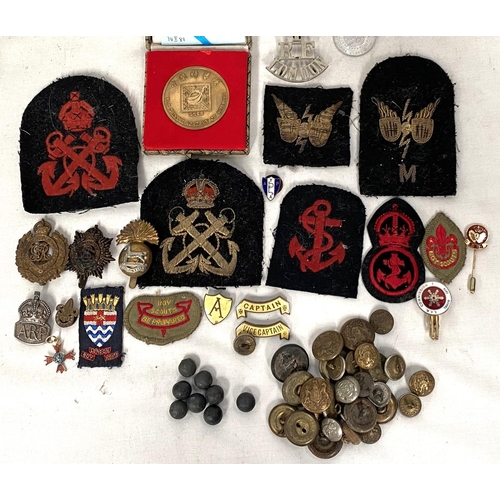 92 - A silver A.R.P badge, a selection of various military badges and buttons including cloth etc