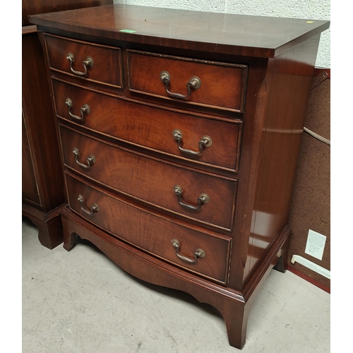 947 - A reproduction figured mahogany chest of 3 long and 2 short drawers on bracket feet by 