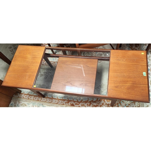 989 - A mid 20th century teak G-Plan 'Fresco' coffee table with teak and glass sectional top with shelf be... 