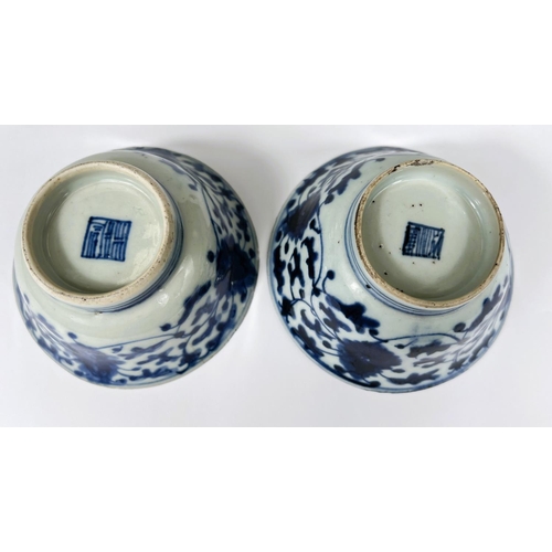 411 - A pair of Chinese 18th century blue and white bowls with floral decoration both with square seal mar... 