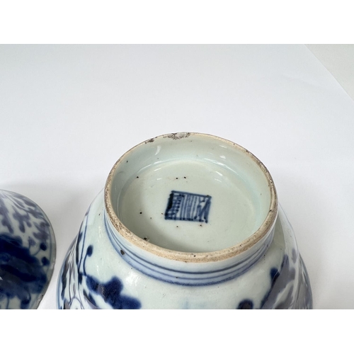 411 - A pair of Chinese 18th century blue and white bowls with floral decoration both with square seal mar... 