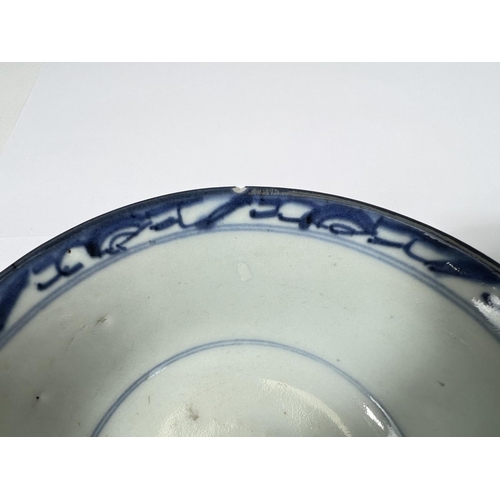 413 - Two Chinese 18th century blue and white bowls with floral decoration, square seal mark to base 14cm ... 