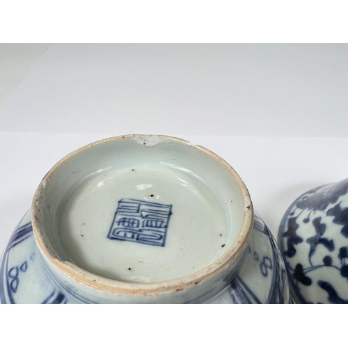 413 - Two Chinese 18th century blue and white bowls with floral decoration, square seal mark to base 14cm ... 