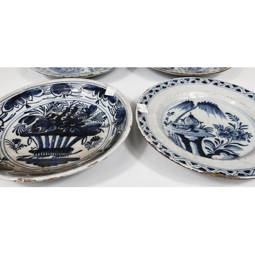 515 - Four 18th century Dutch Delft plates, blue and white, variously decorated with flowers and trees all... 