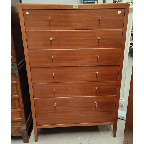 1033 - A mid 20th century tall chest of five long drawers and two short Loughborough Furniture