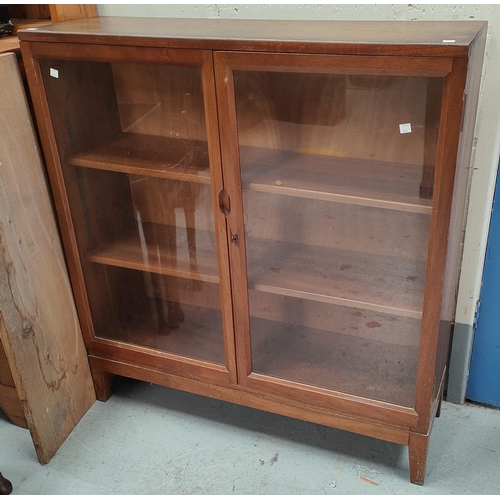 1040 - A mid 20th century teak double glazed door bookcase, 98 x 91cm; A modern oak occasional table with s... 