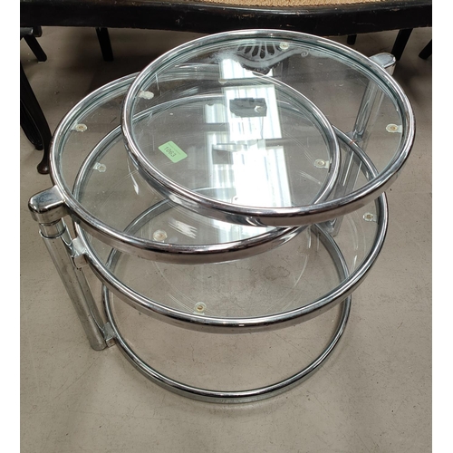 1063 - A 1970's style chrome and glass 3 tier circular nest of swivelling tables